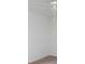 Empty bedroom shows clean white walls and carpet with minimal decor at 5727 Faulconbridge Rd, Charlotte, NC 28227