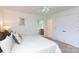 Bright bedroom with a white quilt bed, closet, and window providing ample light at 5727 Faulconbridge Rd, Charlotte, NC 28227