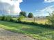 Expansive backyard with lush greenery and beautiful views of the surrounding landscape at 60 White Oaks Dr, Taylorsville, NC 28681