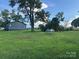 A view of the side and rear of the property from a wide open backyard at 60 White Oaks Dr, Taylorsville, NC 28681