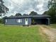 Charming single-story home with a well-maintained lawn and convenient carport at 60 White Oaks Dr, Taylorsville, NC 28681