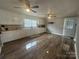 Bright kitchen with white cabinetry, hardwood floors, ample countertop space, and natural lighting at 60 White Oaks Dr, Taylorsville, NC 28681