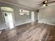 Open living room with hardwood floors and access to other rooms at 60 White Oaks Dr, Taylorsville, NC 28681