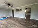 Bright living room showcasing hardwood floors and open archways to other rooms at 60 White Oaks Dr, Taylorsville, NC 28681