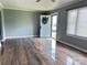 Spacious living room featuring hardwood floors, white trim, neutral wall color and lots of light at 60 White Oaks Dr, Taylorsville, NC 28681