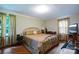 Cozy bedroom with wood floors, natural light, and gold accents, providing a serene retreat at 6039 Donna Dr, Charlotte, NC 28213