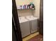 Efficient laundry room with side-by-side washer and dryer units at 6039 Donna Dr, Charlotte, NC 28213