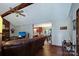 Open-concept living space seamlessly connecting to the kitchen and dining area, with wood-look flooring at 6039 Donna Dr, Charlotte, NC 28213