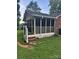 Attached screened porch is the perfect spot to kick back and relax and enjoy the outdoors at 6039 Donna Dr, Charlotte, NC 28213