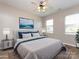 Bedroom with natural light, wood floors, and a ceiling fan at 621 Pine Links Dr, Tega Cay, SC 29708