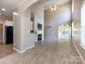 Bright and airy living room featuring hardwood floors and a fireplace at 621 Pine Links Dr, Tega Cay, SC 29708