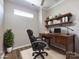 Home office featuring a wooden desk, shelving, and a comfortable office chair at 621 Pine Links Dr, Tega Cay, SC 29708