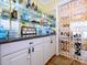 A stylish bar featuring floating glass shelves with mirrored backdrop at 6311 Red Maple Dr, Charlotte, NC 28277