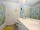 Well-lit bathroom with double sink vanity, decorative shower curtain, and charming wall decor at 6311 Red Maple Dr, Charlotte, NC 28277