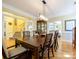 Elegant dining room showcasing crown molding and wood floors at 6311 Red Maple Dr, Charlotte, NC 28277