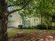 Charming two-story home with an attached garage, landscaped front yard, and inviting front porch at 6311 Red Maple Dr, Charlotte, NC 28277