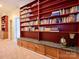 Library room featuring floor to ceiling built in shelving and cabinet storage at 6311 Red Maple Dr, Charlotte, NC 28277