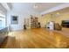 Large living room features hardwood floors, large windows, and open space for entertaining at 6311 Red Maple Dr, Charlotte, NC 28277