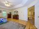 Open main bedroom with two dressers, hardwood floors, and a ceiling fan at 6311 Red Maple Dr, Charlotte, NC 28277