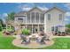 Spacious backyard with a fire pit area, multilevel deck and screened porch perfect for entertaining at 6326 Jepson Ct, Charlotte, NC 28214