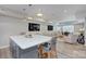 Open basement living area featuring large island with seating and spacious lounge area at 6326 Jepson Ct, Charlotte, NC 28214