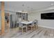 Basement kitchenette features a large island with seating, stainless steel appliances, and TV at 6326 Jepson Ct, Charlotte, NC 28214