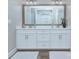 Well-lit bathroom with a double vanity, large mirror, and ample storage space at 6326 Jepson Ct, Charlotte, NC 28214
