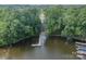 An aerial view of a boat ramp on a lake, surrounded by lush greenery, inviting lakeside adventures at 6326 Jepson Ct, Charlotte, NC 28214