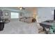 Spacious bonus room with ample seating, a desk, and a large window at 6326 Jepson Ct, Charlotte, NC 28214