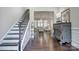 Inviting home foyer featuring hardwood floors, staircase and decorative console table at 6326 Jepson Ct, Charlotte, NC 28214