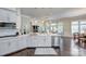 Modern kitchen with stainless steel appliances, white cabinetry, and a large center island at 6326 Jepson Ct, Charlotte, NC 28214