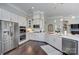 Bright kitchen with stainless steel appliances, sleek white cabinets and tile backsplash at 6326 Jepson Ct, Charlotte, NC 28214