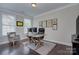 Functional home office with a spacious desk, comfortable seating, and ample natural light at 6326 Jepson Ct, Charlotte, NC 28214