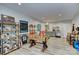 Finished basement has a game room with a foosball table and custom shelving at 6326 Jepson Ct, Charlotte, NC 28214