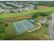 Aerial view of community tennis courts and surrounding homes, promoting an active lifestyle at 6326 Jepson Ct, Charlotte, NC 28214