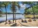 Scenic waterfront property with views of the lake, boat dock, and comfortable seating at 6326 Jepson Ct, Charlotte, NC 28214