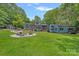 Large, well-maintained backyard with a fire pit and ample space for recreation at 640 Lochaven Rd, Weddington, NC 28173