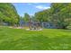Expansive backyard with a fire pit area, perfect for outdoor gatherings at 640 Lochaven Rd, Weddington, NC 28173