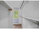 Walk-in closet with shelving and a window at 640 Lochaven Rd, Weddington, NC 28173