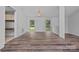 Open dining area with wood floors, natural light, and ample space for entertaining at 640 Lochaven Rd, Weddington, NC 28173
