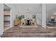 Elegant dining room with modern lighting, ample seating, and a scenic view from the windows at 640 Lochaven Rd, Weddington, NC 28173