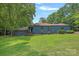 Charming one-story home with blue siding, mature trees, and a well-maintained front lawn at 640 Lochaven Rd, Weddington, NC 28173