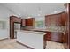 Updated kitchen with stainless steel appliances, granite counters, and tile floors at 640 Lochaven Rd, Weddington, NC 28173