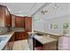 Well lit kitchen featuring granite counters, stainless steel appliances, and views to the backyard at 640 Lochaven Rd, Weddington, NC 28173