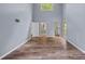 Spacious living room with soaring ceilings, hardwood flooring, and ample natural light at 640 Lochaven Rd, Weddington, NC 28173