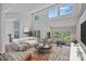 Open living room features high ceilings, ample natural light, wood floors, comfortable seating at 640 Lochaven Rd, Weddington, NC 28173