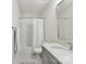Clean bathroom featuring a shower-tub combo, white subway tile, and classic fixtures at 6531 Hazelton Dr, Charlotte, NC 28210