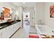 Bright bathroom with white cabinets, soaker tub, and colorful decor for a modern, stylish look at 6531 Hazelton Dr, Charlotte, NC 28210