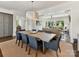 Open floor plan shows dining room with a wooden table and chairs, flowing into the living room at 6531 Hazelton Dr, Charlotte, NC 28210