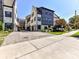 Attractive townhome with brick and siding, a paved driveway, and well-maintained landscaping at 6531 Hazelton Dr, Charlotte, NC 28210